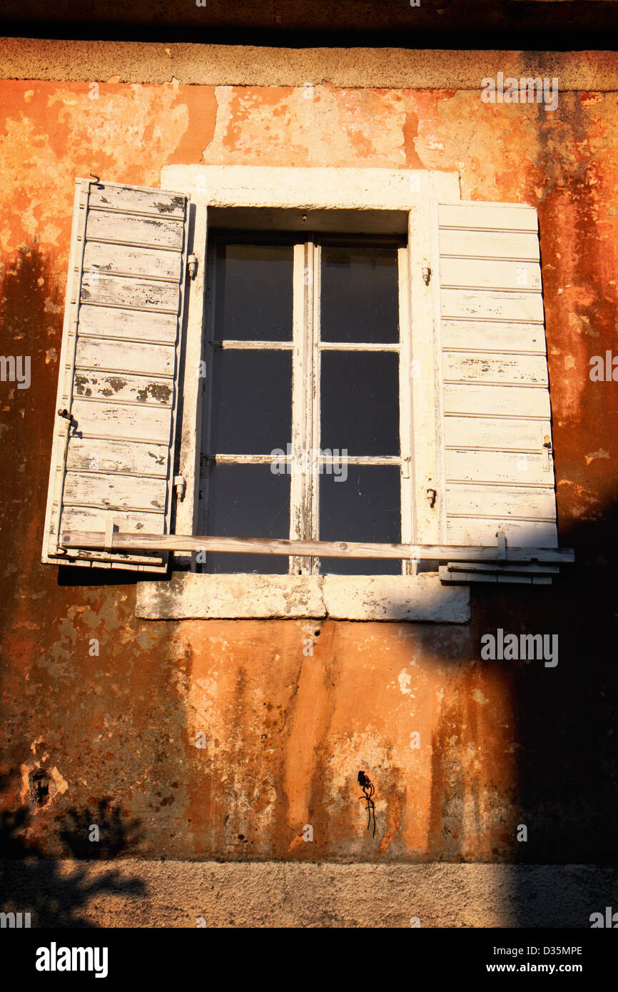 Rustic white window on brown wall Stock Photo - Alamy