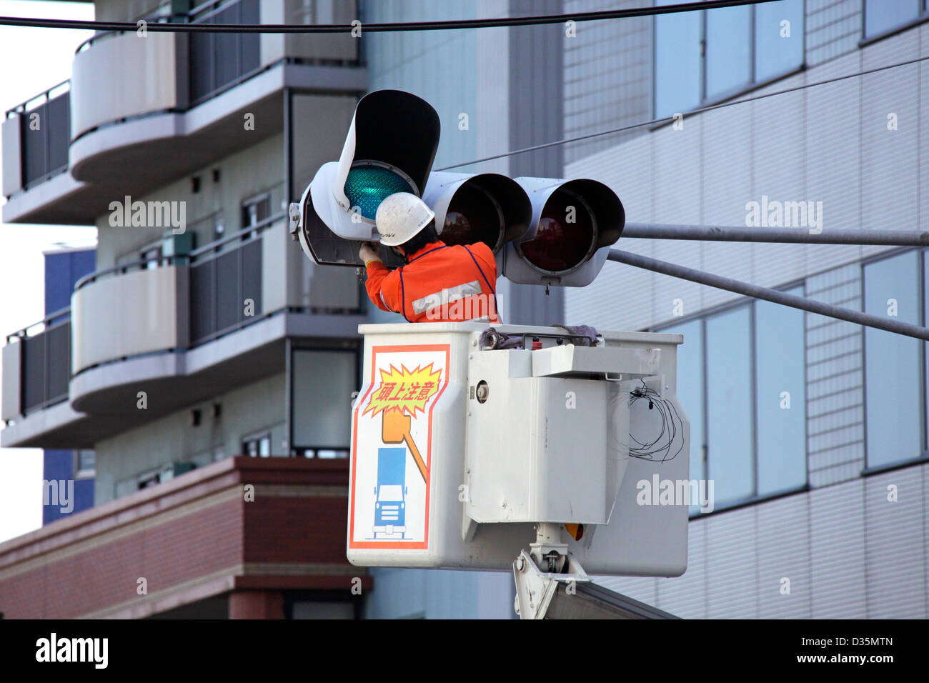 Traffic lights maintenance and cleaning in a town Tokyo Japan Stock Photo Alamy