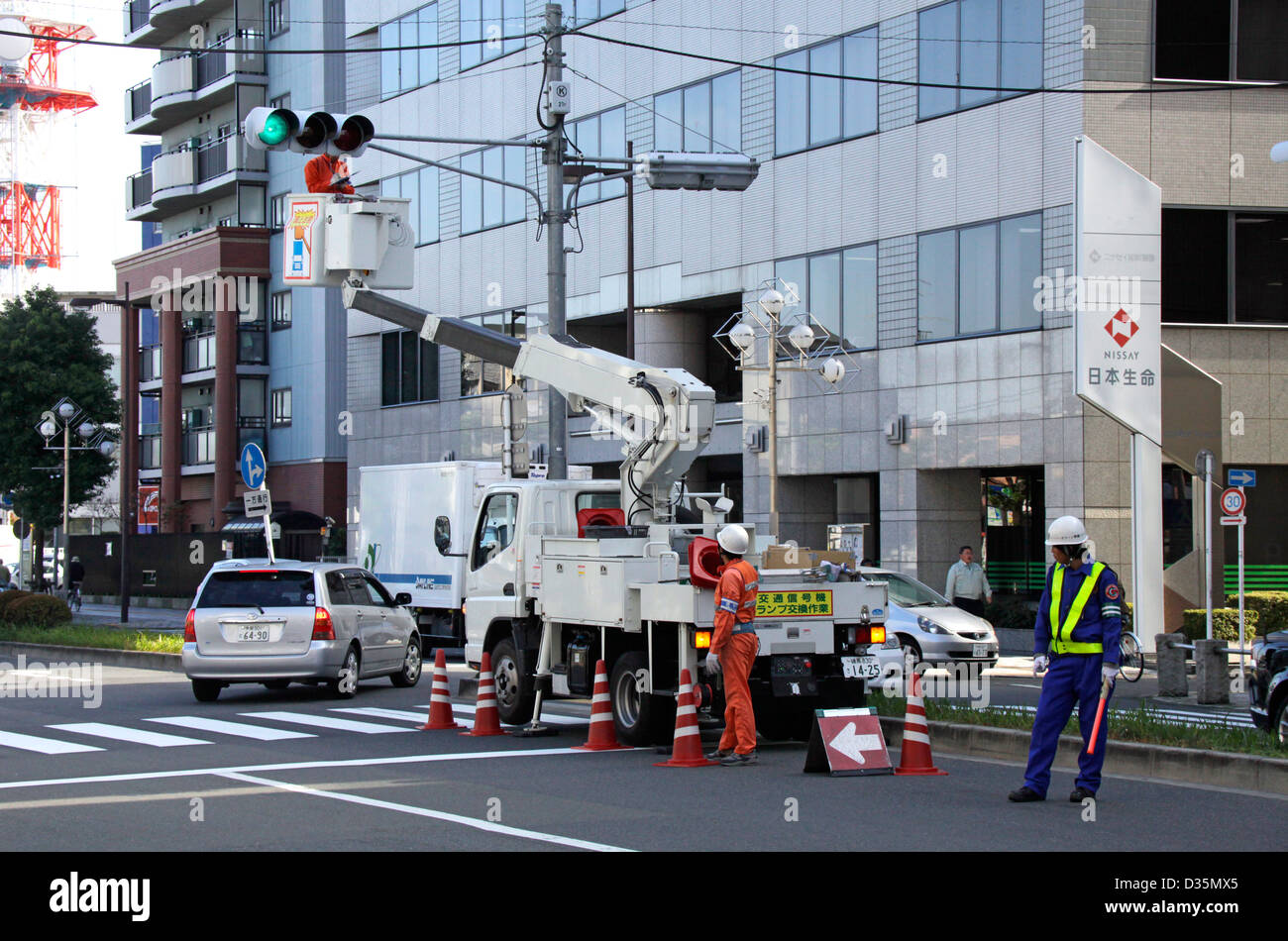 Traffic lights maintenance and cleaning in a town Tokyo Japan Stock