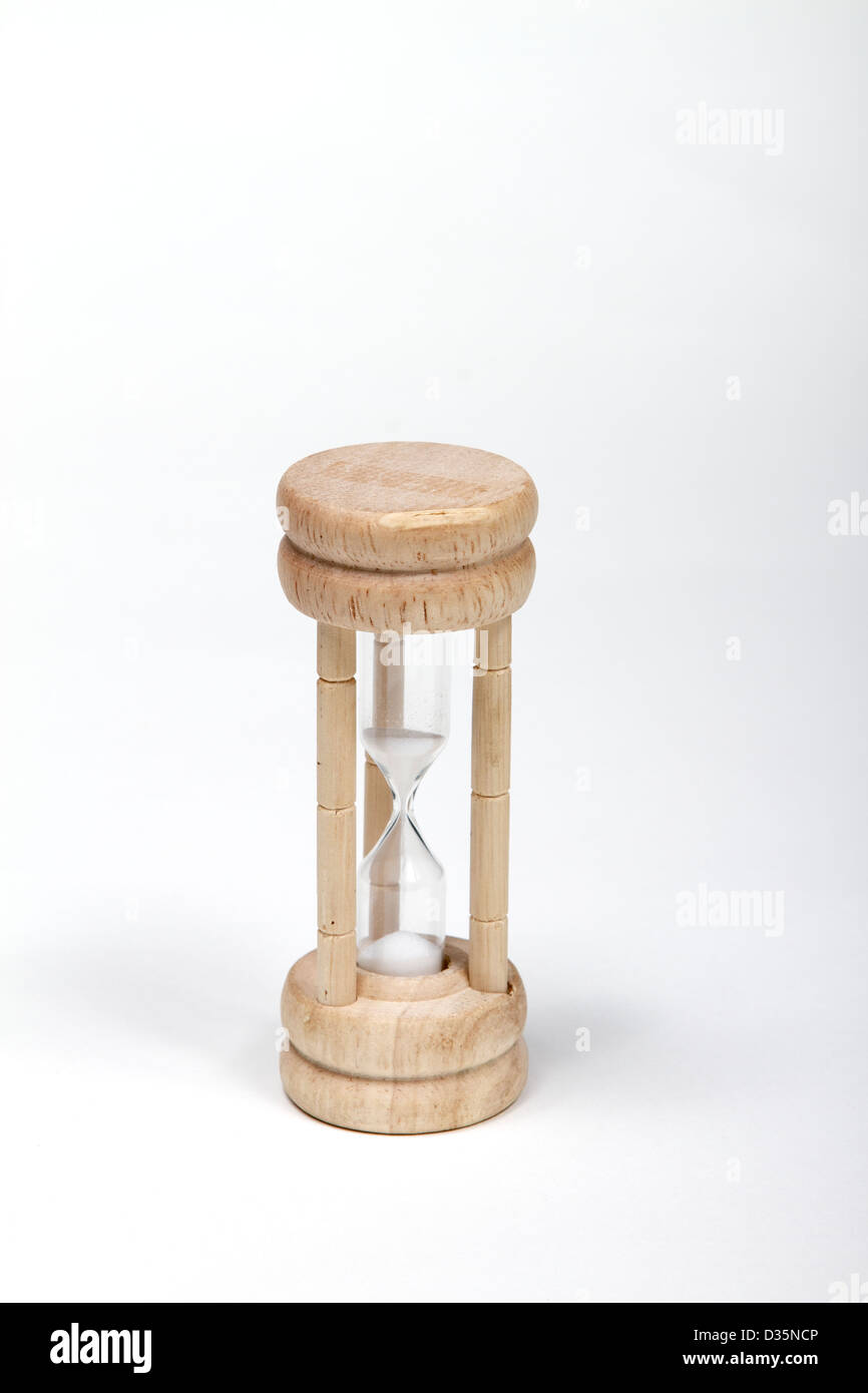 Wooden hourglass timer on a white background Stock Photo