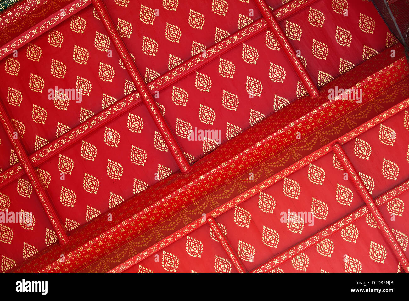 thailand temple pattern,  bangkok culture with celling detail painting in gold and red at Wat Po in BKK Stock Photo