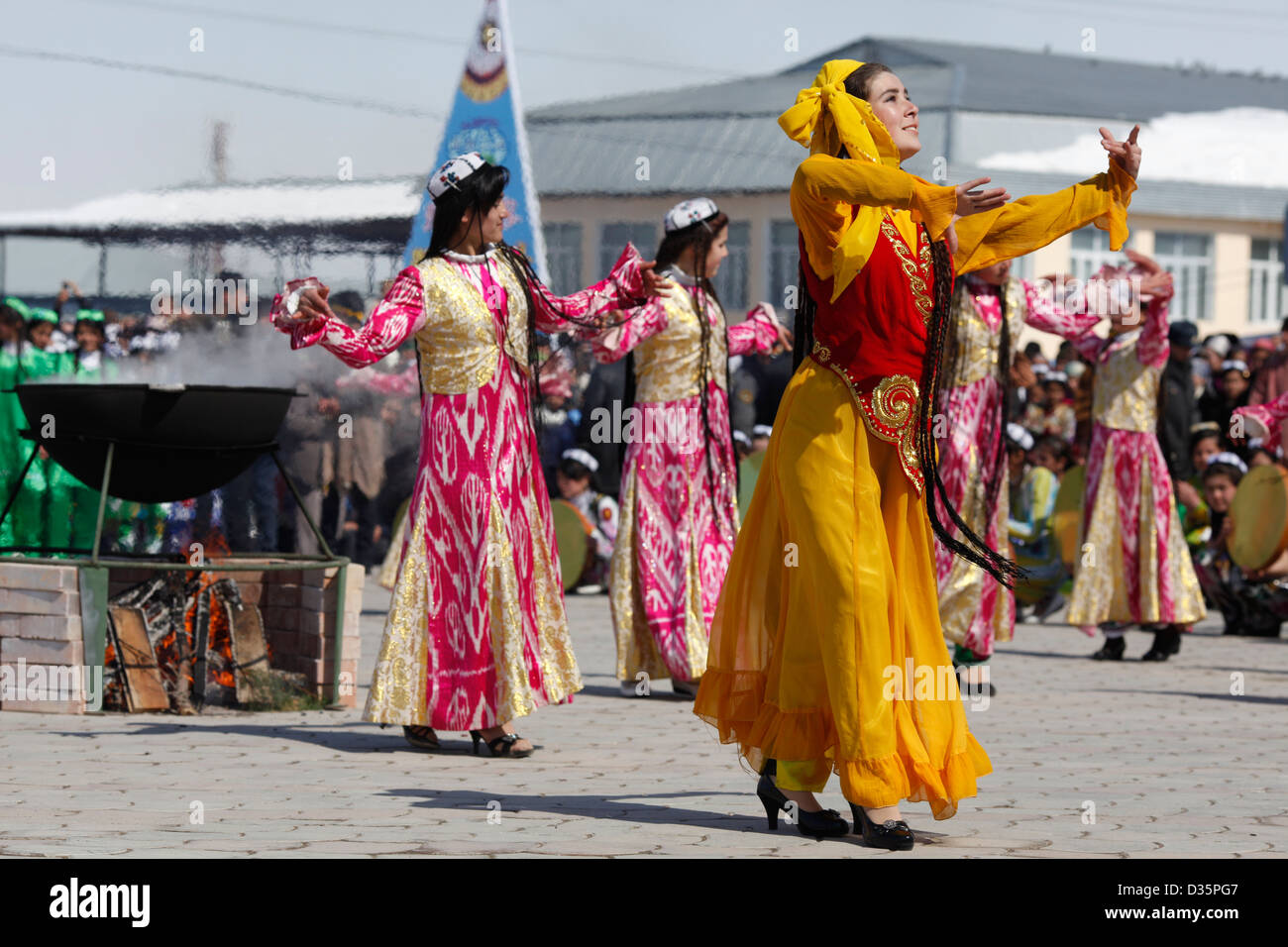 Girls in ethnic dresses dance at a Navruz celebration near Dushanbe ...