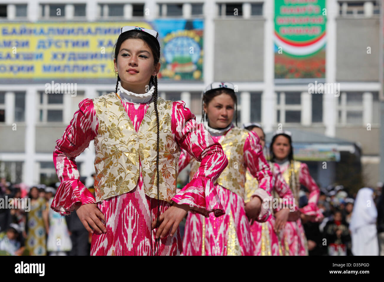 Girls in ethnic dresses dance at a Navruz celebration near Dushanbe ...