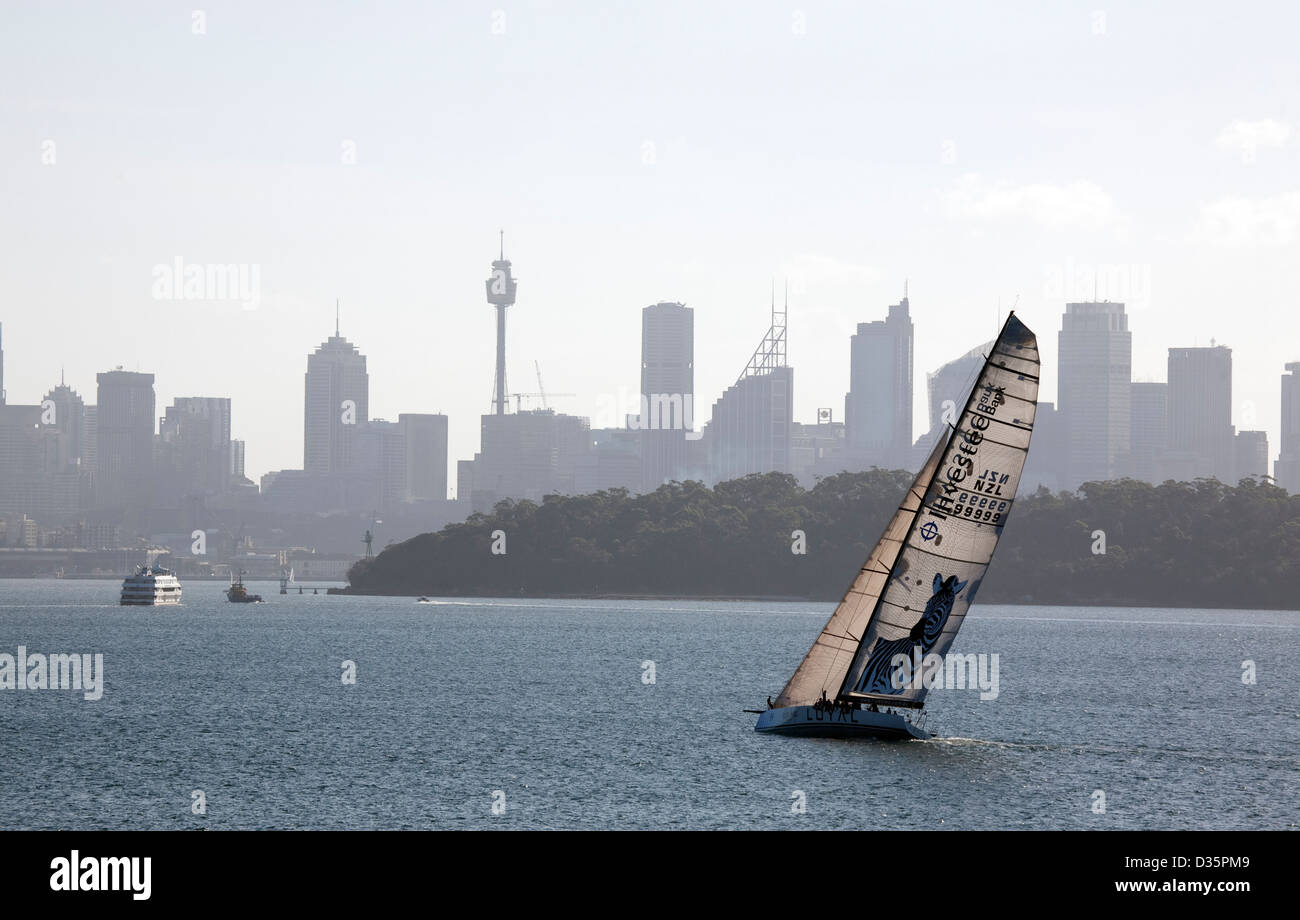 Investec Loyal a racing supermaxi yacht training on Sydney Harbour for the Sydney to Hobart yacht race. Stock Photo