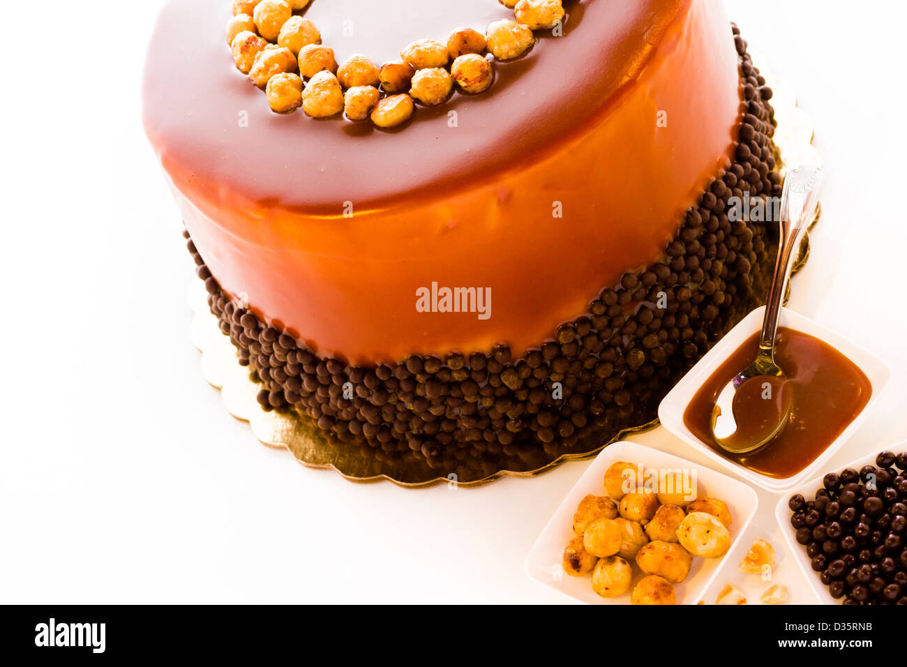GOurmet chocolate, hazelnut, and caramel cake on white background Stock