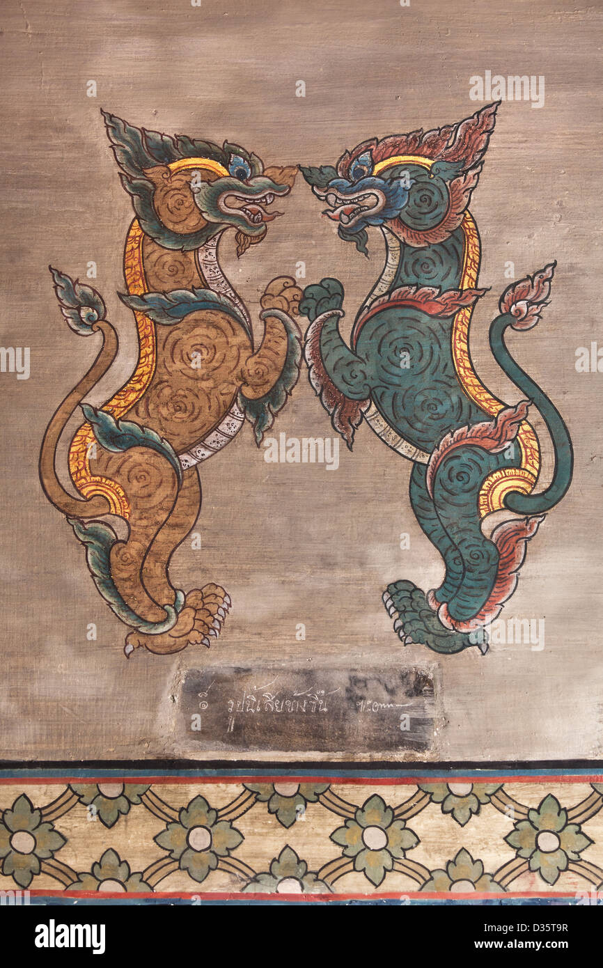 thailand temples,  bangkok art culture with wall painting of animals in gold and blue at Wat Po in BKK Stock Photo