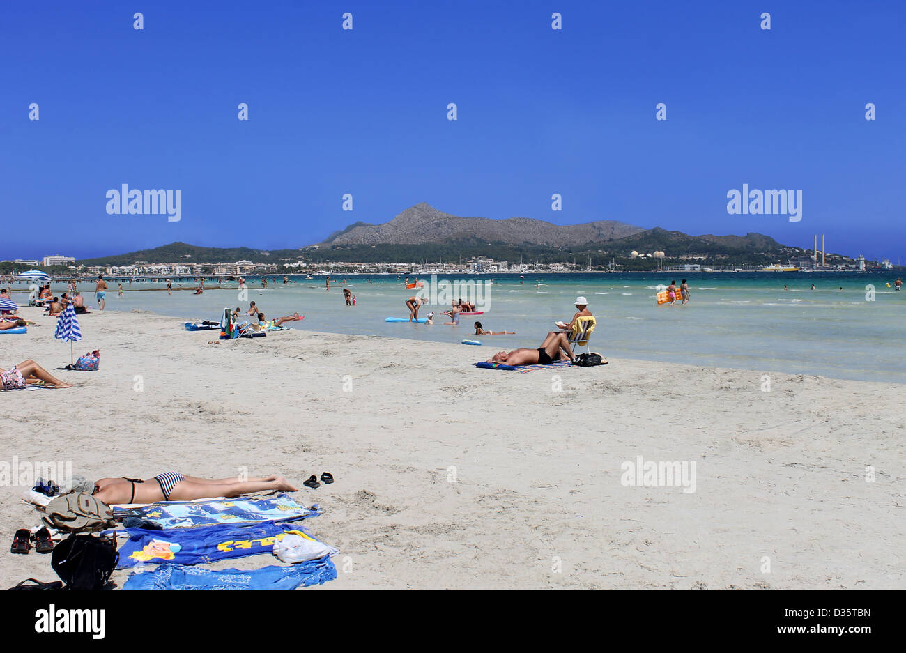 Playa de Palma, Spain, August 23, 2012: Photograph of people relaxing on a sunny summer day on Playa de Palma beach in Mallorca, Stock Photo