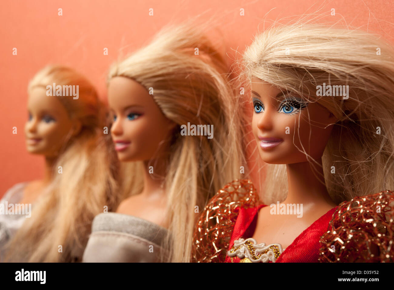 three barbie dolls