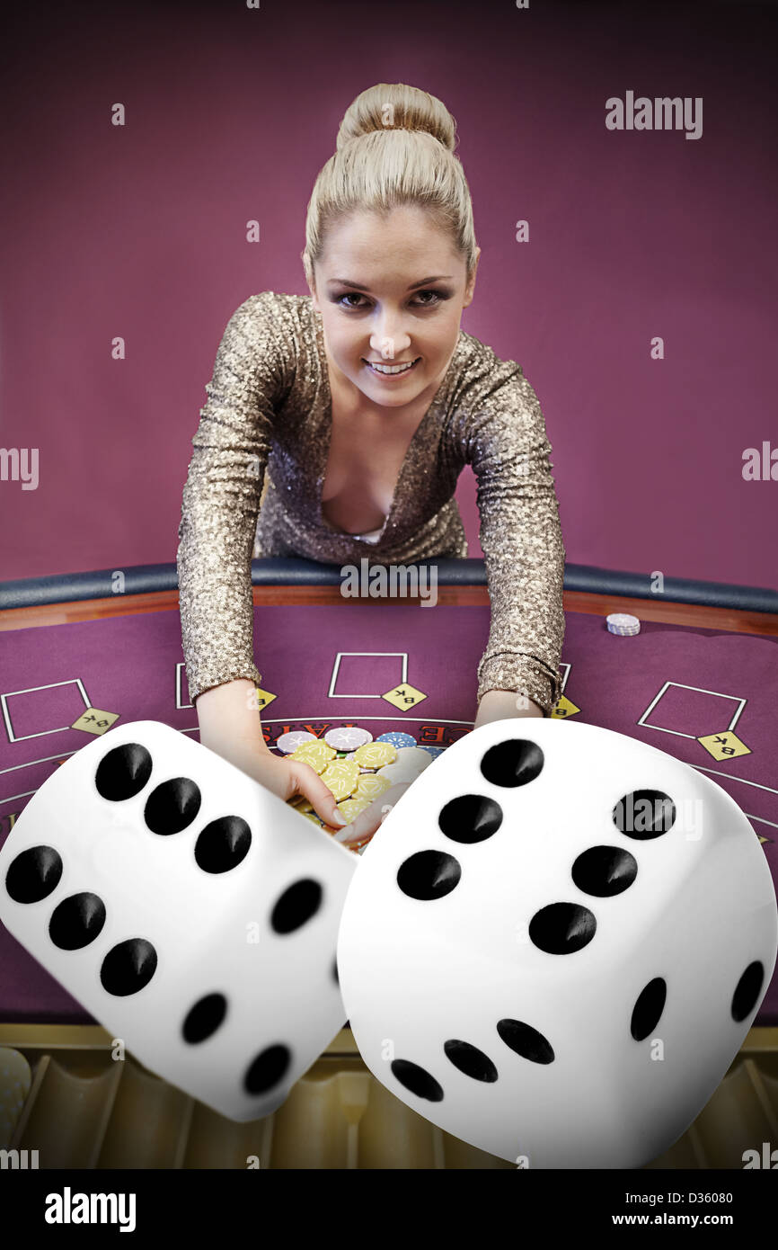 Blonde woman grabbing chips with digital dice Stock Photo