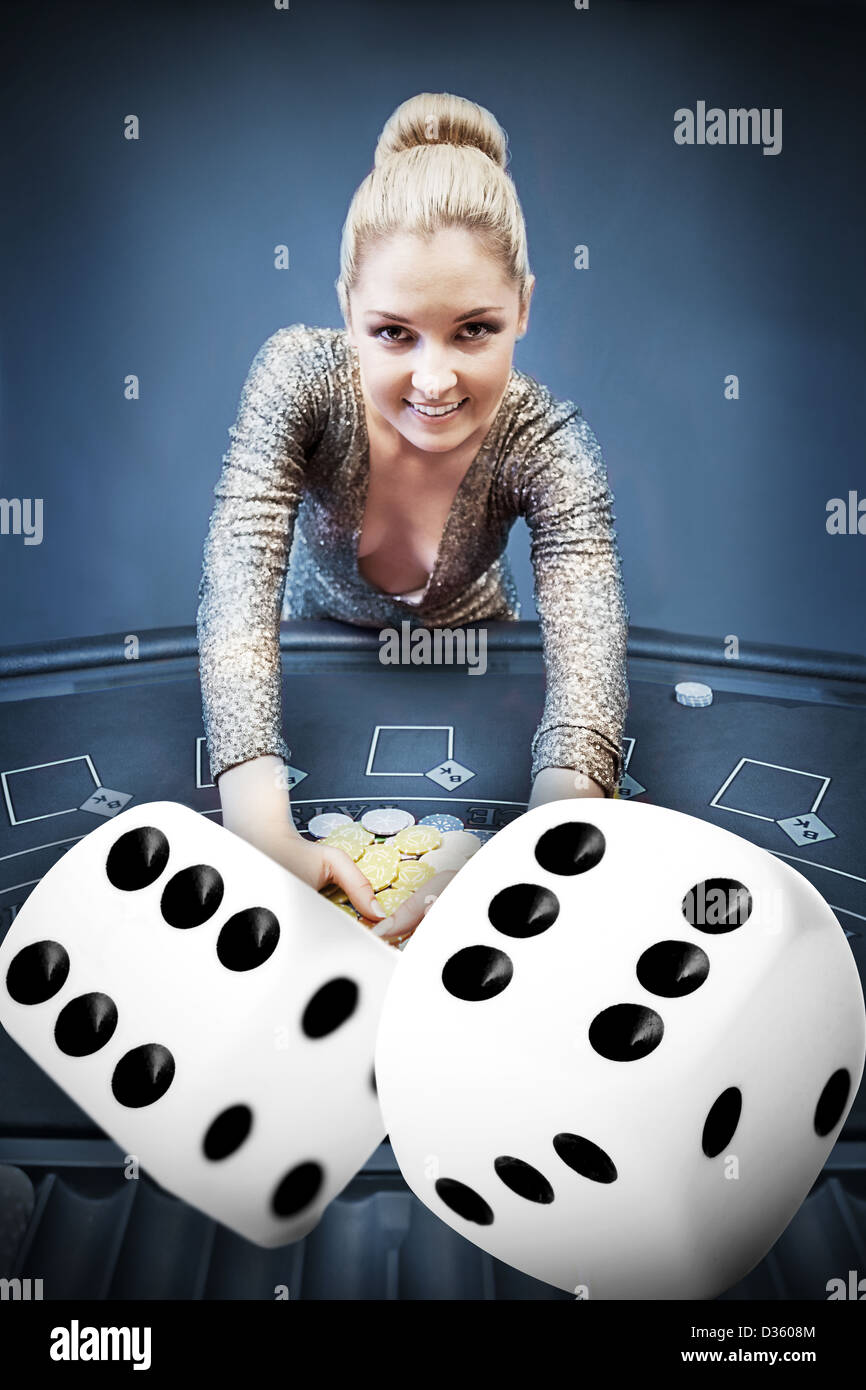 Blonde woman grabbing chips with digital dice Stock Photo