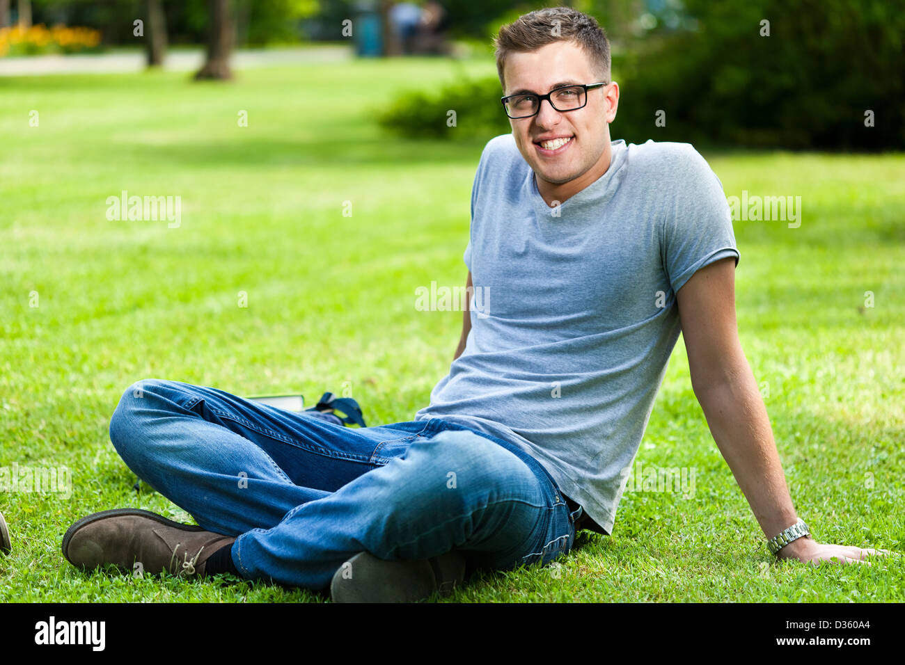 Outdoor portrait of a smiling student Stock Photo - Alamy