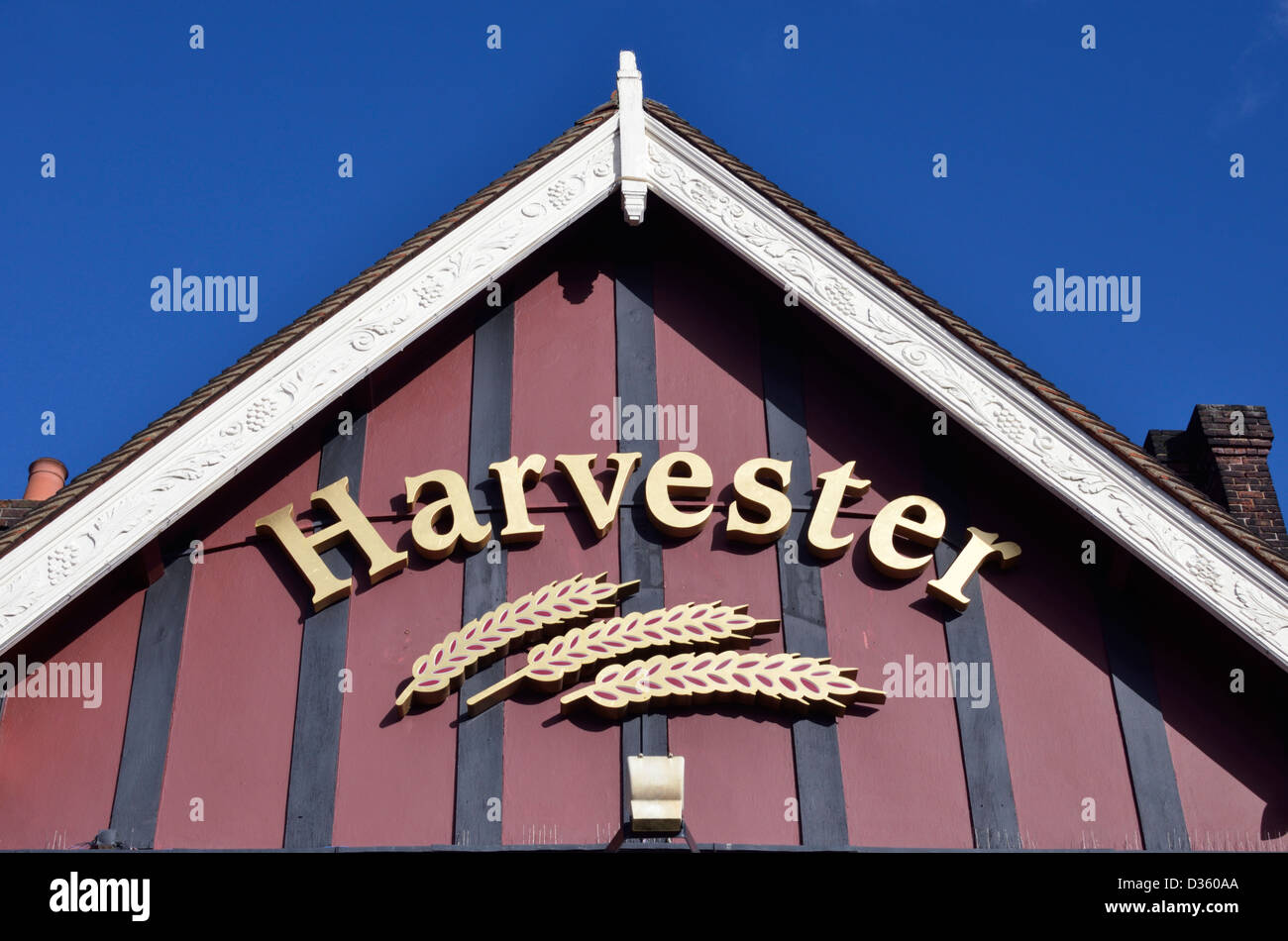 Harvester sign logo outside a pub restaurant, London, UK Stock Photo
