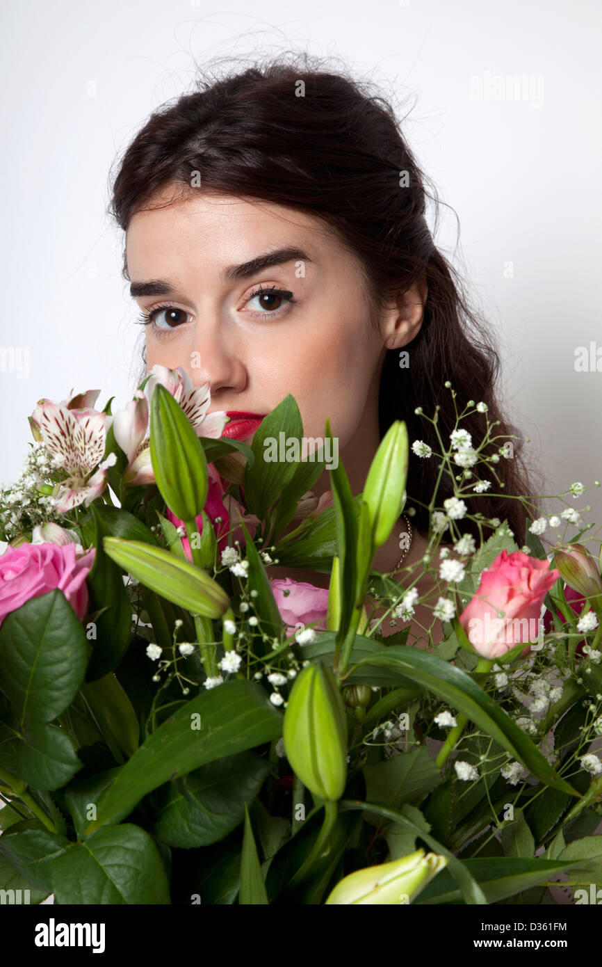 Womans Eyes above Bunch of Flowers Stock Photo - Alamy