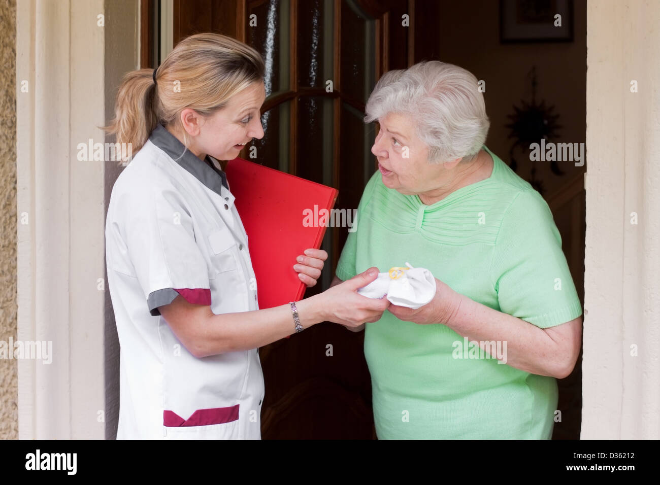 nurse greeted with her patient Stock Photo