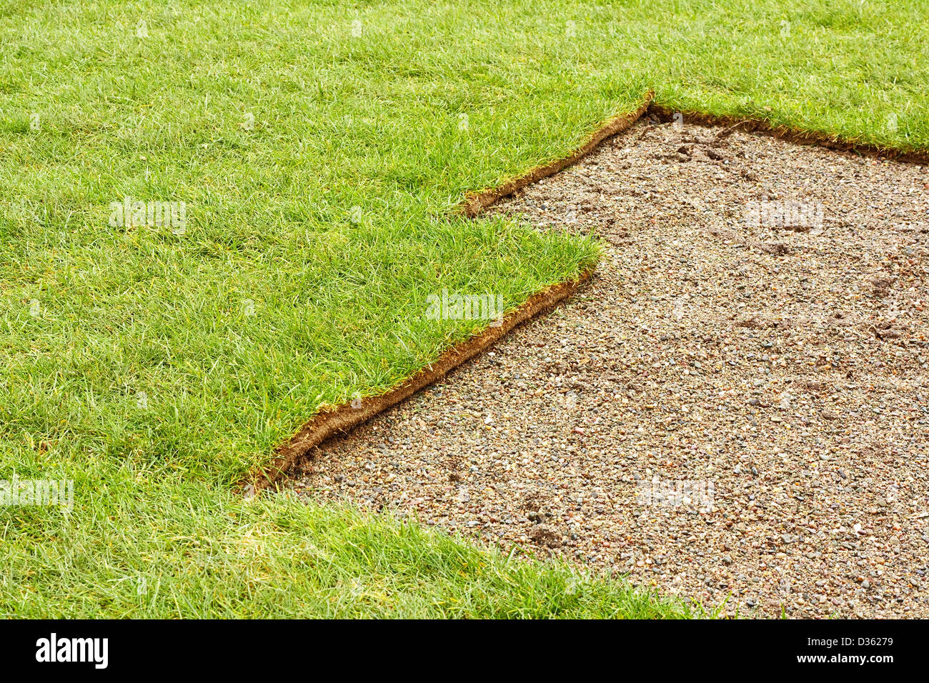 The perfect turf lawn in progress of being laid Stock Photo