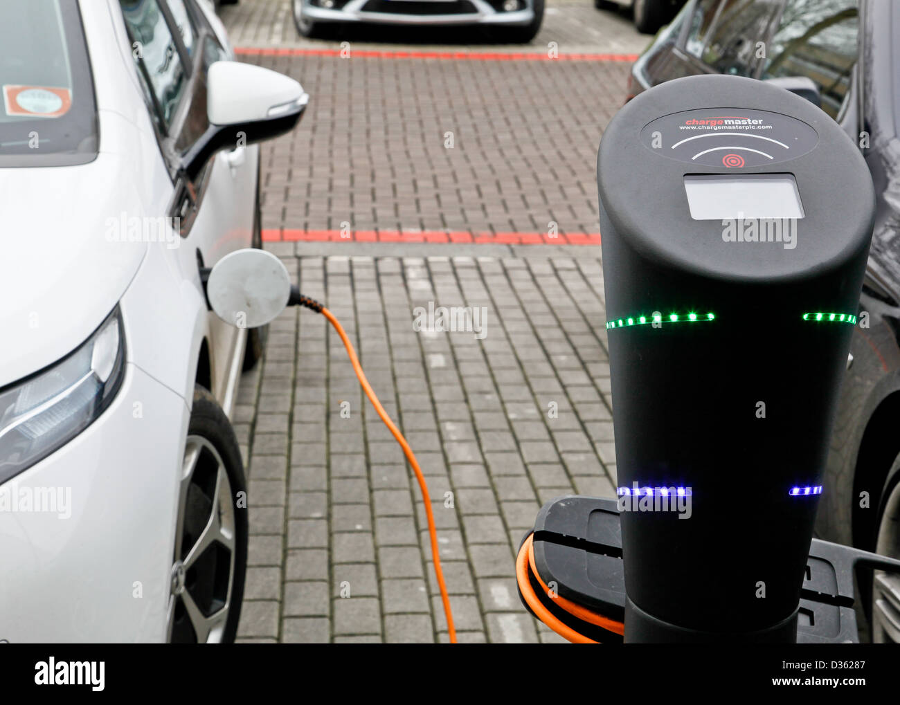 An electric car being recharged at a street charging station in Milton Keynes Stock Photo Alamy