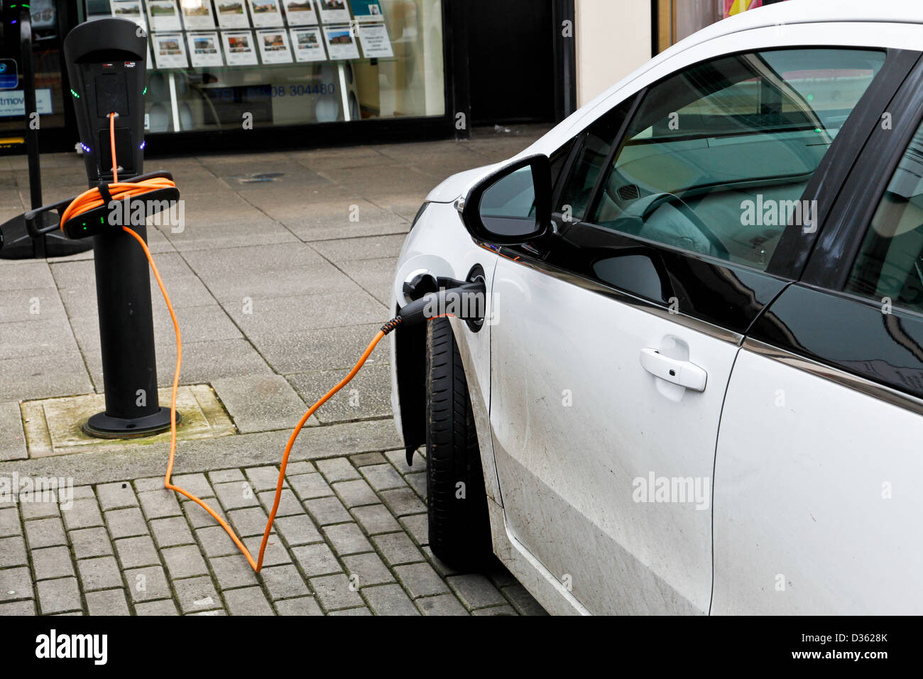 An electric car being recharged at a street charging station in Milton Keynes Stock Photo Alamy