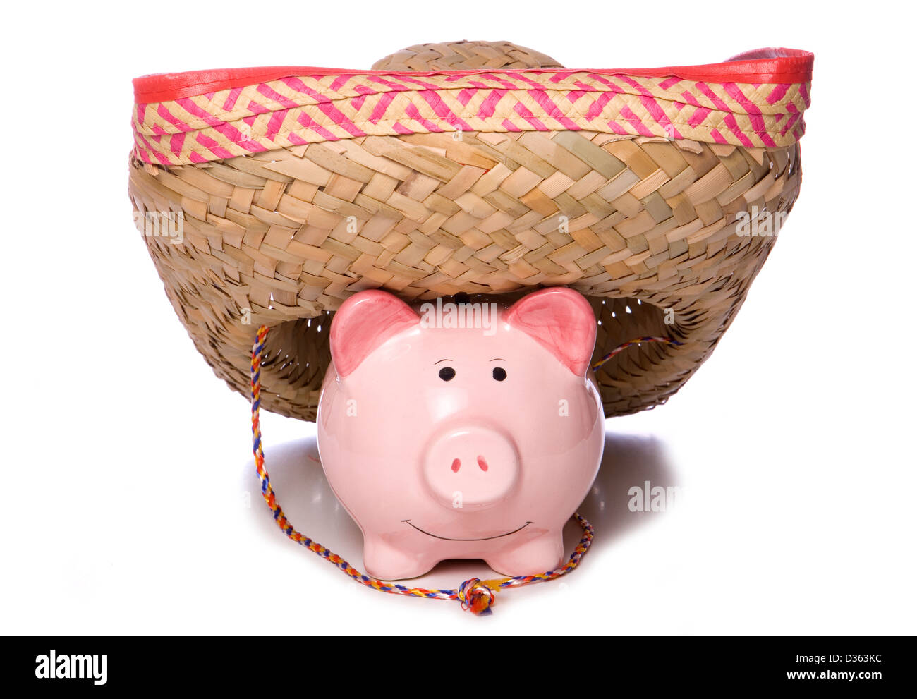 Piggy bank wearing a sombrero studio cutout Stock Photo