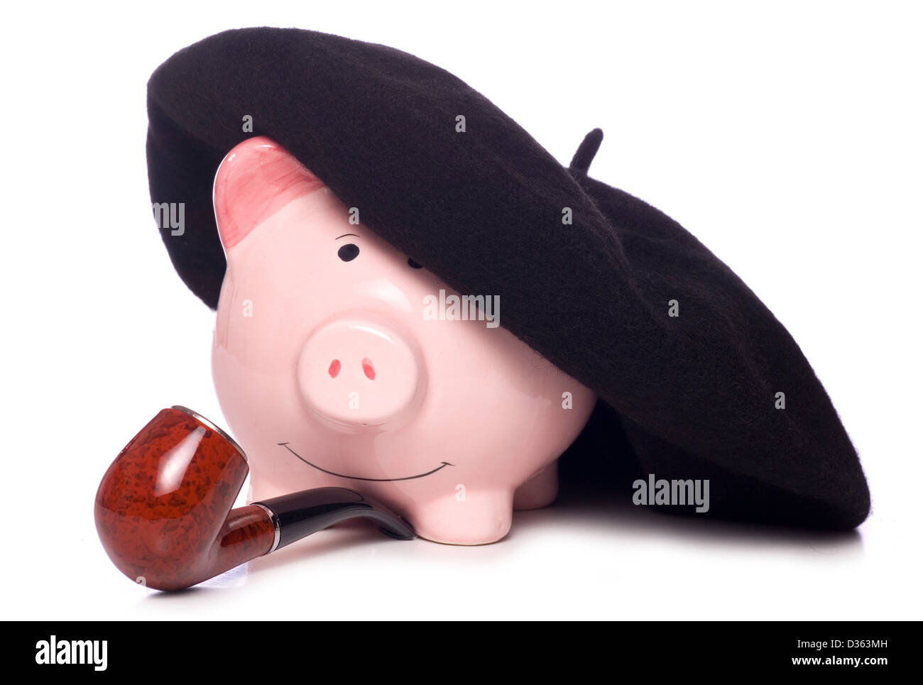 Piggy bank with french hat and pipe studio cutout Stock Photo
