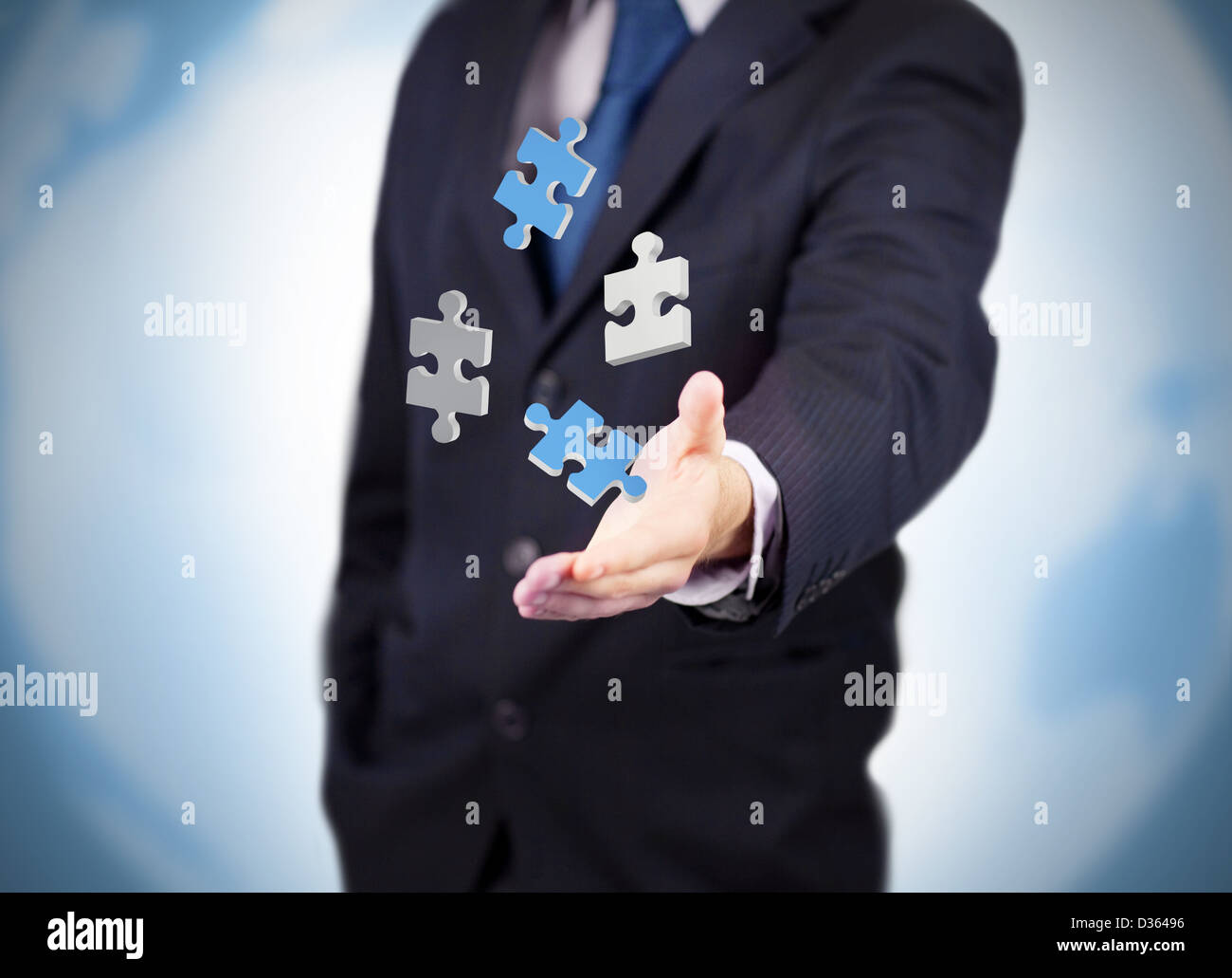 Businessman with digital puzzles levitating Stock Photo