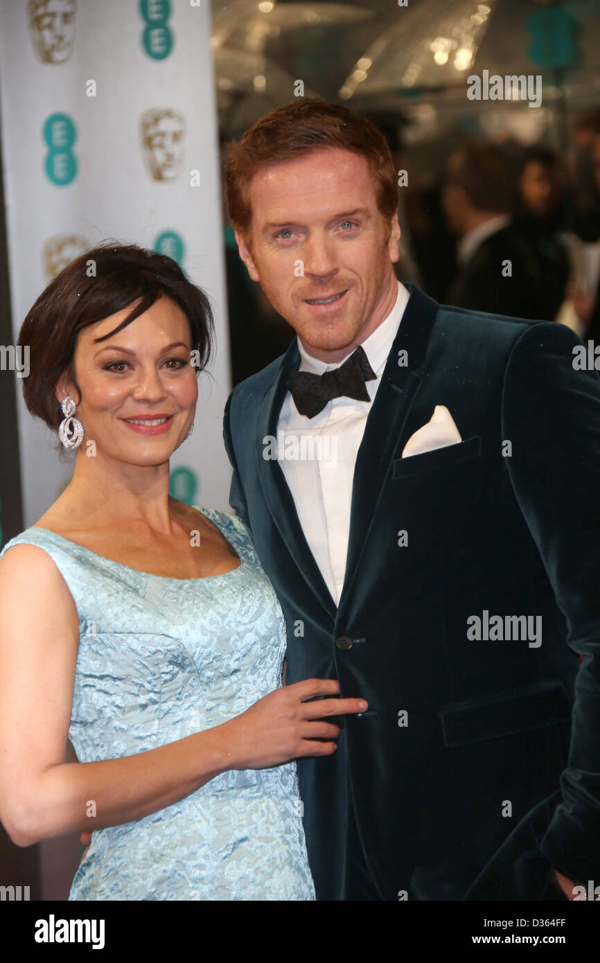 Actor Damian Lewis (r) and Helen McCrory arrive at the EE British Academy Film Awards at The Royal Opera House in London, England, on 10 February 2013. Photo: Hubert Boesl Stock Photo