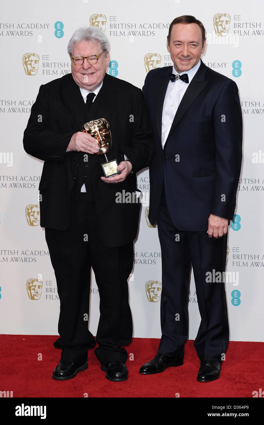 London, UK. Feb 10th, 2013. Sir Alan Parker, winner of the BAFTA Fellowship, and Kevin Spacey pose in the Press Room at the EE British Academy Film Awards at The Royal Opera House on February 10, 2013 in London, England. Credit: London Entertainment/Alamy Live News Stock Photo