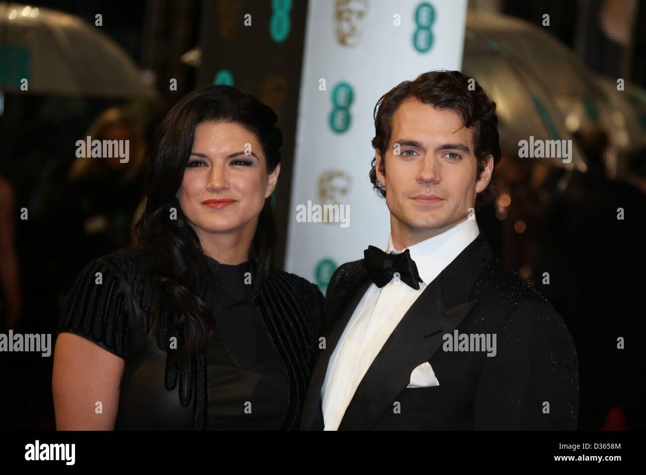 Los Angeles, USA. 22nd February 2013. Actors Henry Cavill and hois  girlfriend Gina Carano arrive at the GREAT British Film Reception at  British Consul General's Residence in Los Angeles, USA, on 22