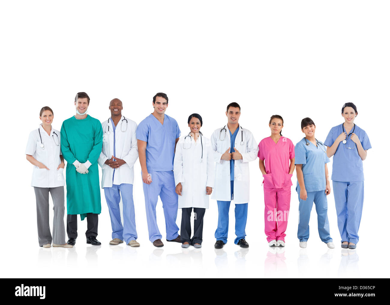 Happy medical team standing in line Stock Photo