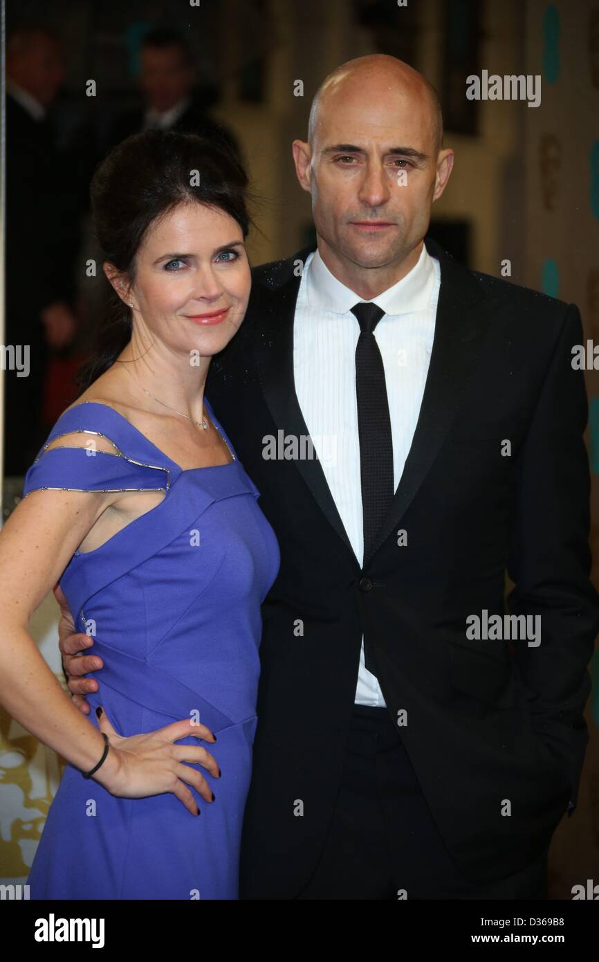 Actor Mark Strong and tv producer Liza Marshall arrive at the EE British Academy Film Awards at The Royal Opera House in London, England, on 10 February 2013. Photo: Hubert Boesl Stock Photo
