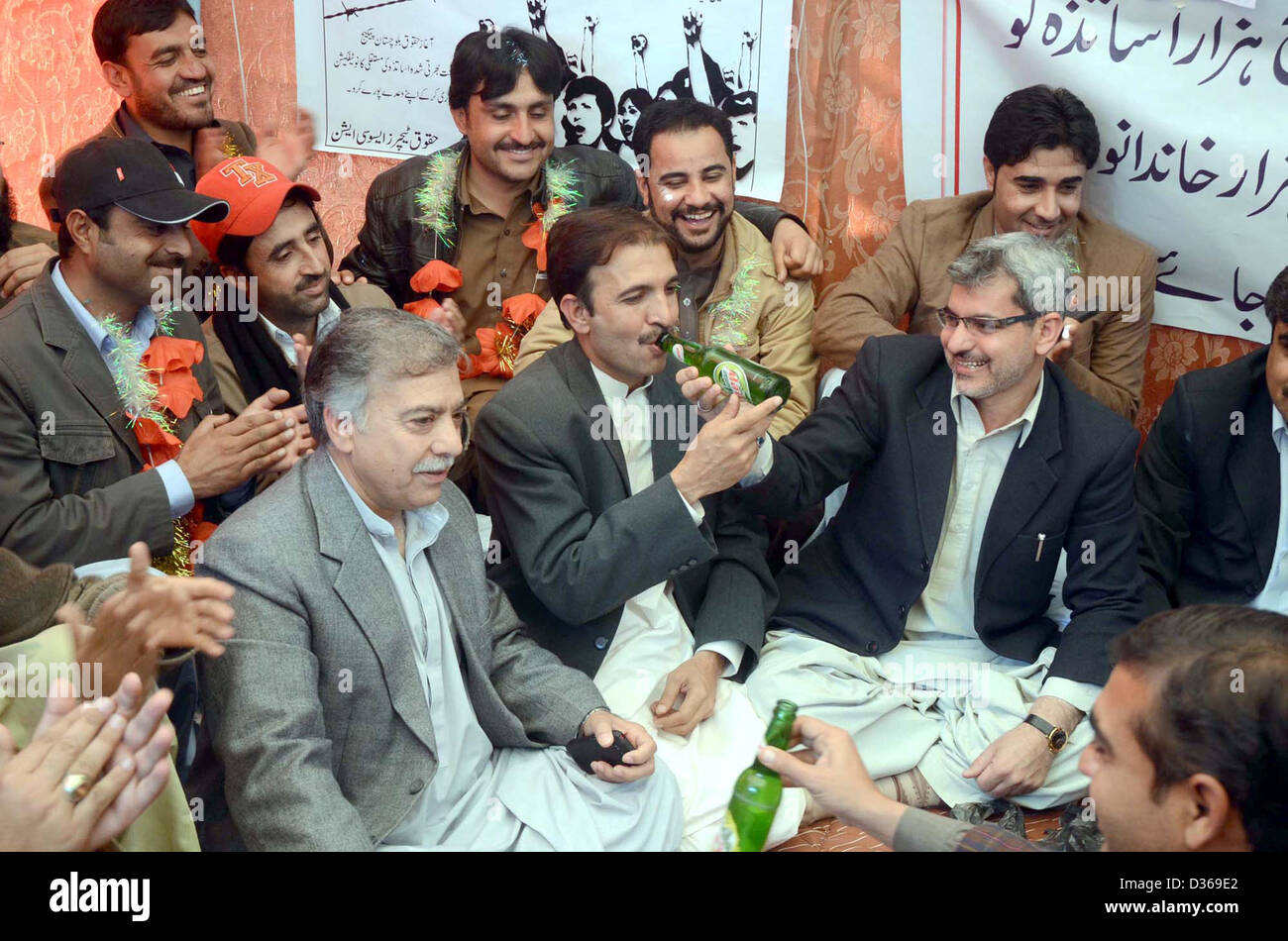 Deputy Commissioner Quetta, Abdul Mansoor Kakar  dialogues with teachers who are sit-in in favor of their demands at Haqooq Teachers Association  protest camps near Quetta press club on Monday, February 11, 2013. Balochistan Package  teachers were on hunger strike for last 10 days. Stock Photo