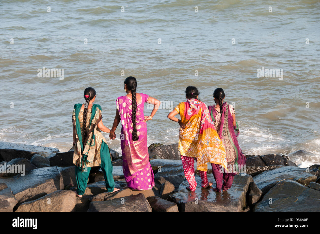 Beach Sea Waterfront  woman in Sari Puducherry ( Pondicherry ) India Tamil Nadu Stock Photo