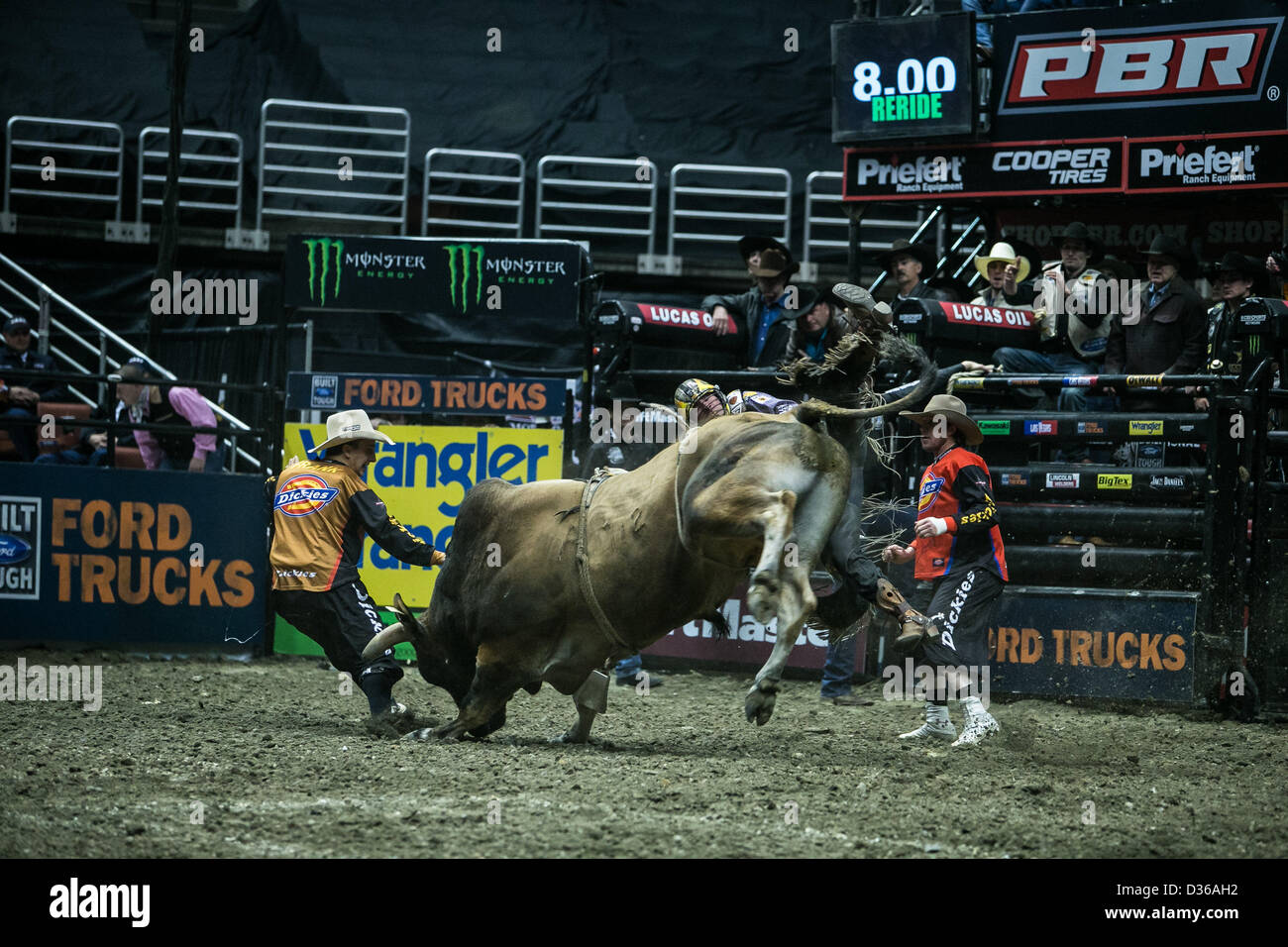 08.02.2013. Anaheim, Califonria, USA.  Luke Snyder (Raymore, MO) riding bull Pit Boss . While Bull Fighter Frank Newsom protects him during the Professional Bull Riders, Liftmaster Invitational at the Honda Center in Anaheim, CA. � Action Plus Sports Images / Alamy Stock Photo
