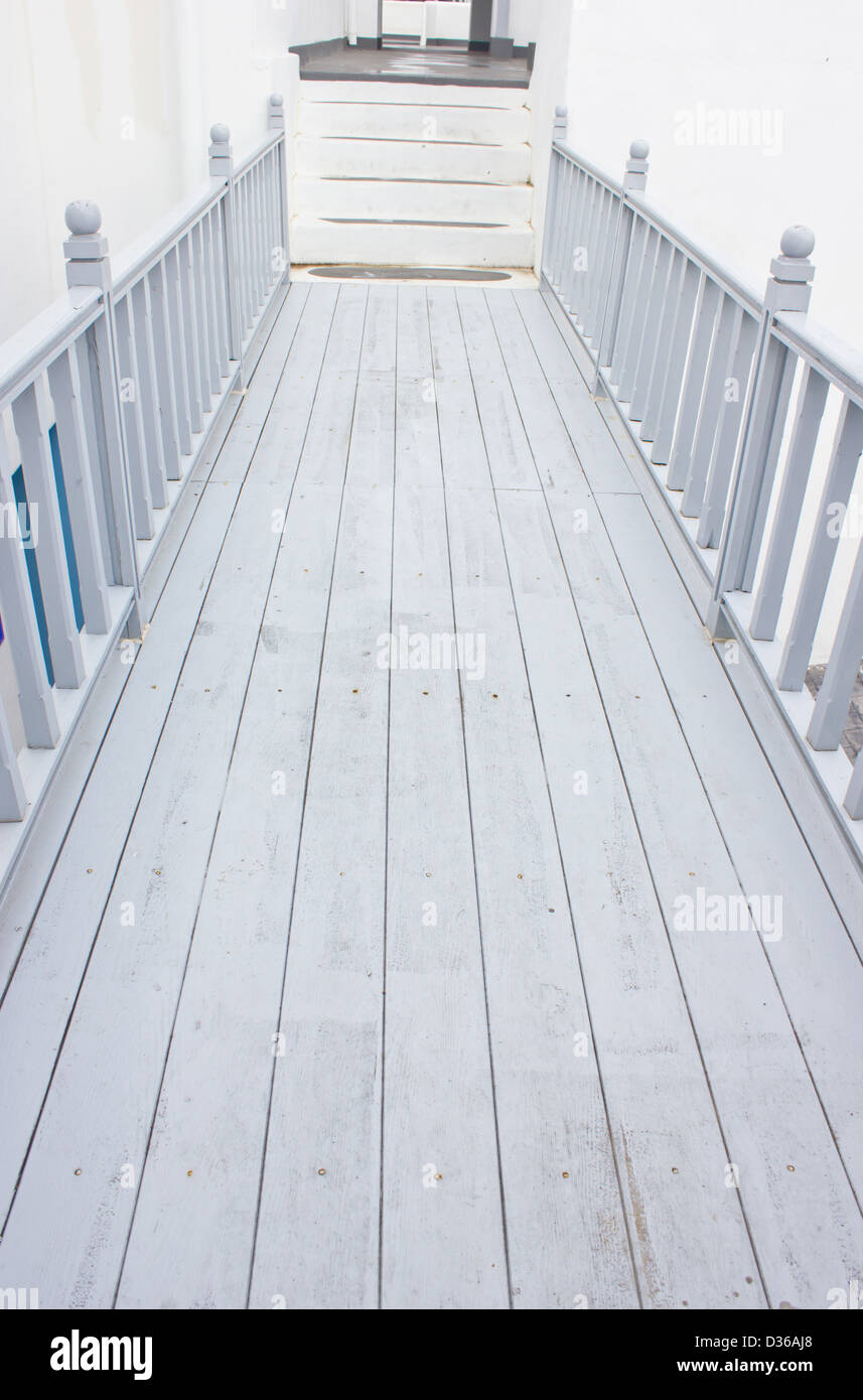 Straight wooden walkway. Stock Photo