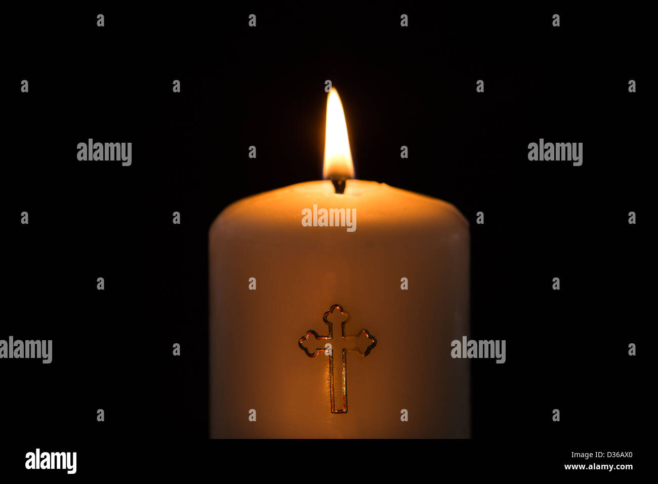 Candle with cross embellishment Stock Photo