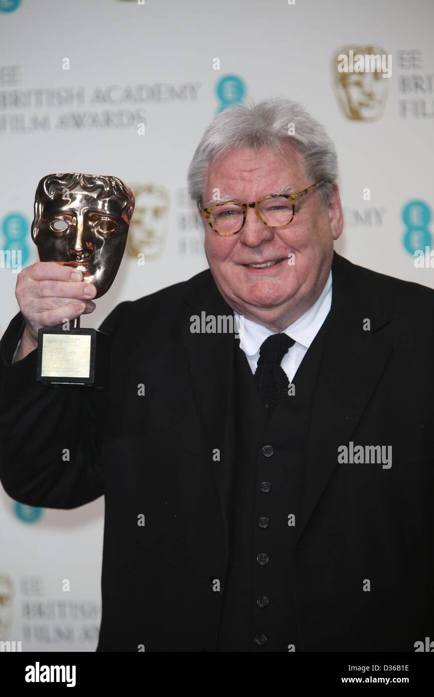 Director Alan Parker poses in the press room of the EE British Academy Film Awards at The Royal Opera House in London, England, on 10 February 2013. Photo: Hubert Boesl Stock Photo