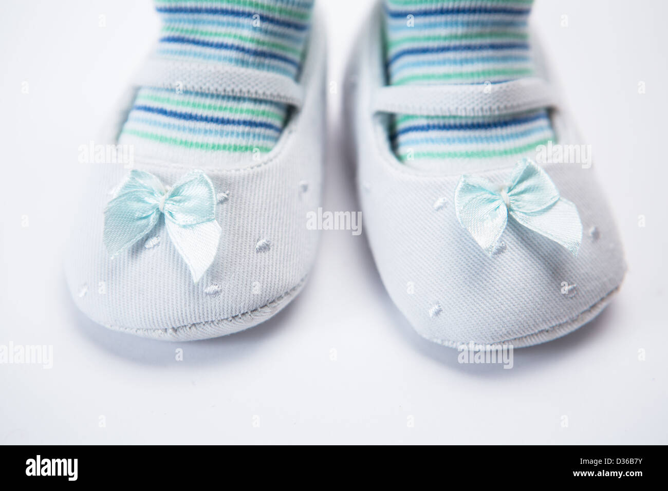 Baby feet in booties Stock Photo Alamy