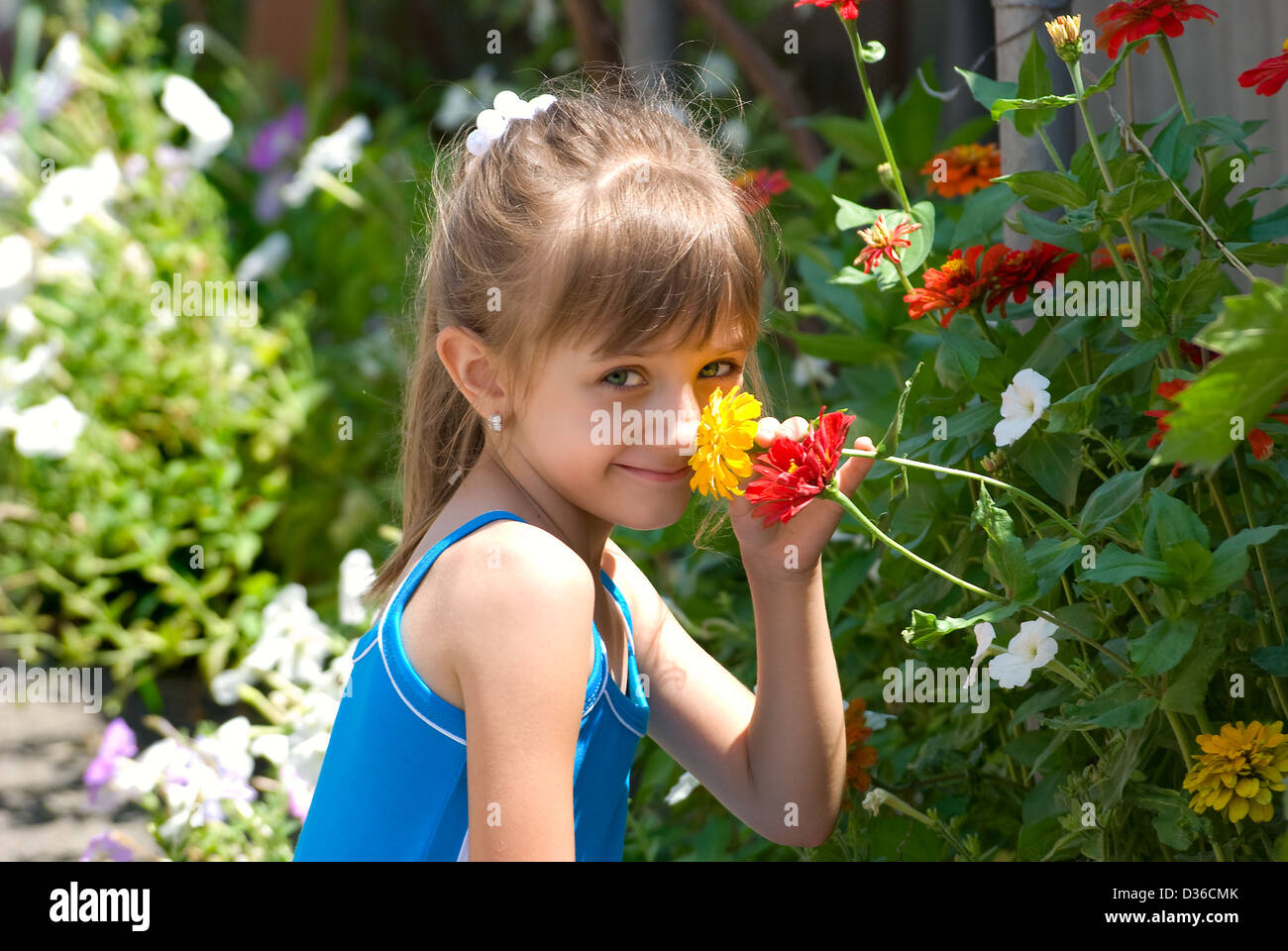 Child smells flowers hi-res stock photography and images - Alamy