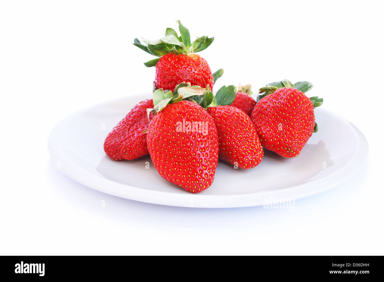 Strawberries in plate isolated on white background Stock Photo - Alamy