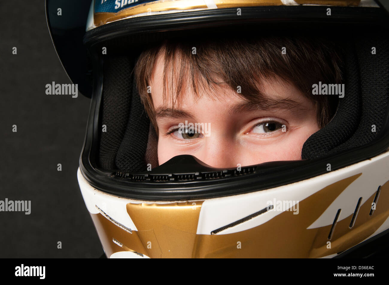 Child Wearing A Motorsport Crash Helmet Stock Photo Alamy
