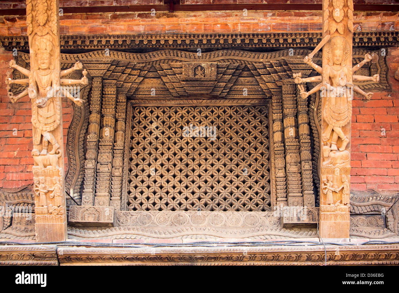 Ancient, ornately carved wood window frames on an old building in