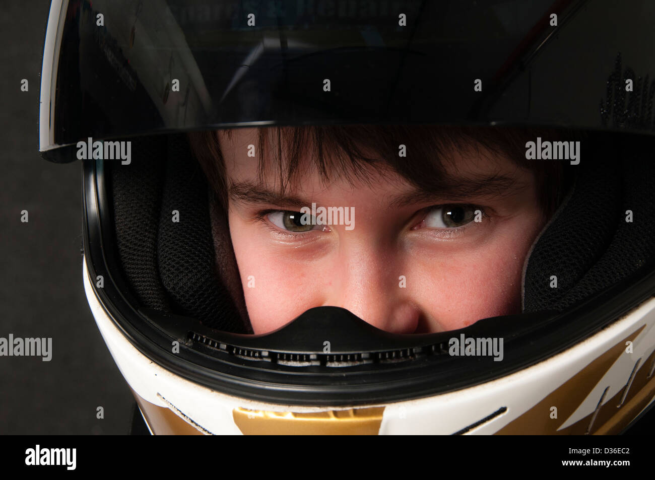 Child Wearing A Motorsport Crash Helmet Stock Photo Alamy