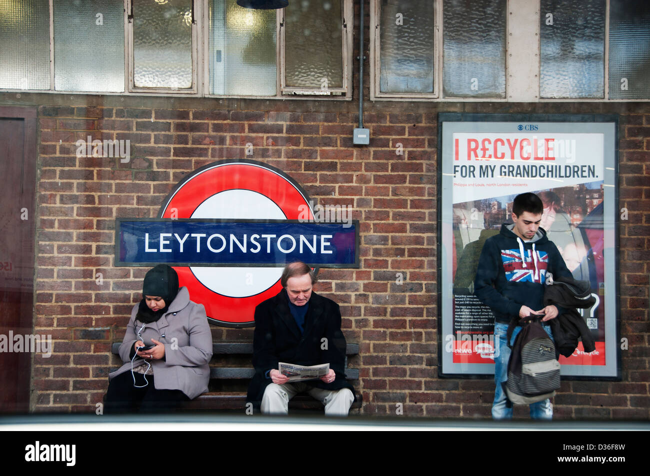 Passengers waiting at Leytonstone underground station, seen from a passing tube Stock Photo