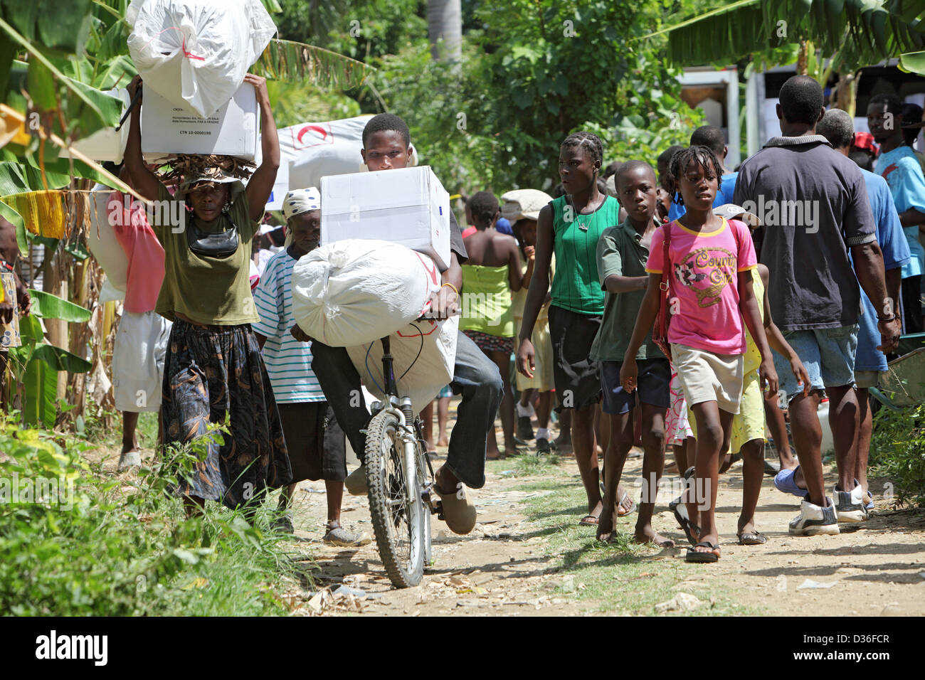 Leogane, Haiti, locals with relief goods on the street Stock Photo Alamy