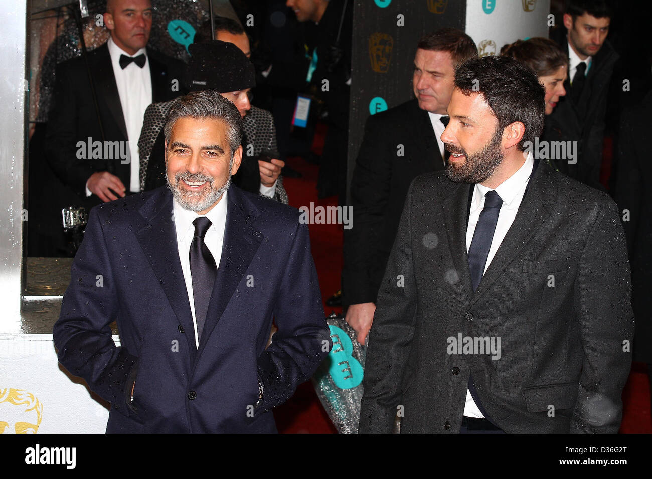 George Clooney & Ben Affleck arrive for the EE British Academy Film Awards - Red Carpet Arrivals at the Royal Opera House. Credi Stock Photo
