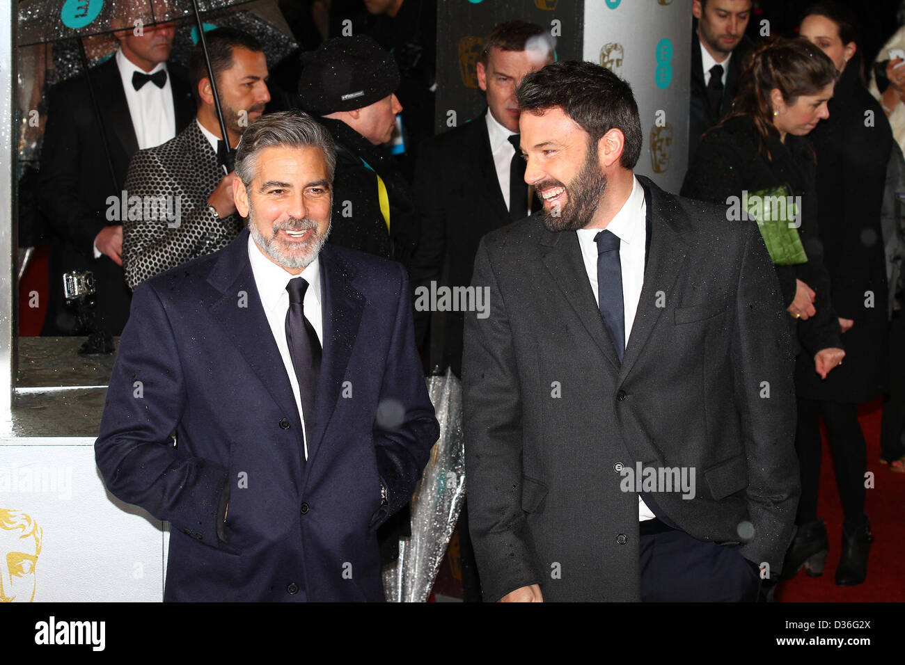 George Clooney & Ben Affleck arrive for the EE British Academy Film Awards - Red Carpet Arrivals at the Royal Opera House. Credi Stock Photo