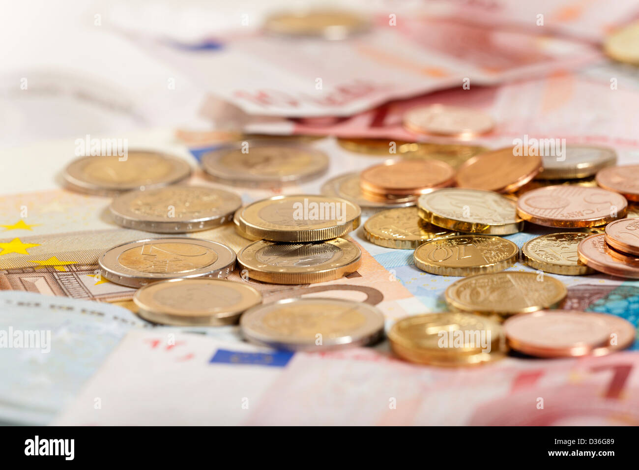 Background of Euro coins and bills Stock Photo - Alamy