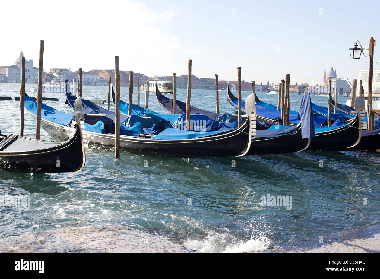 Gondolas sitting empty along the Grand Canal Venice Italy Stock Photo ...