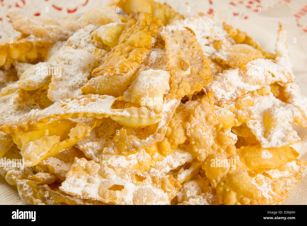 chiacchiere, italian fried carnival cookies with icing sugar Stock