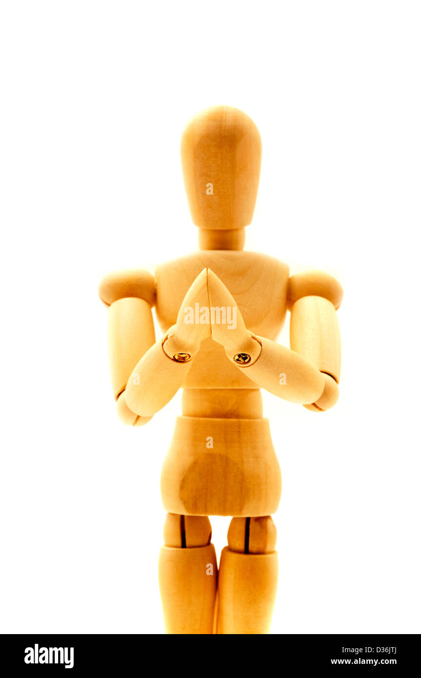 Praying mannequin on a white background Stock Photo