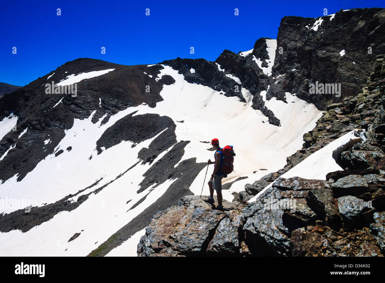 Trekker at Corral del Veleta Sierra Nevada, Granada, Spain Stock Photo